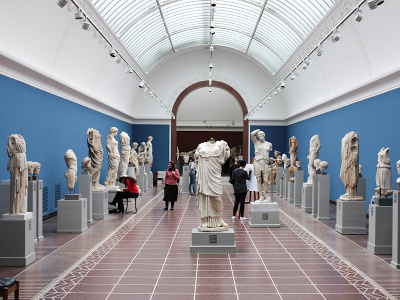 A member showing their card at a museum entrance